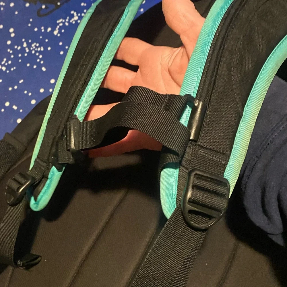 The North Face Jester Black Backpack with Teal Straps